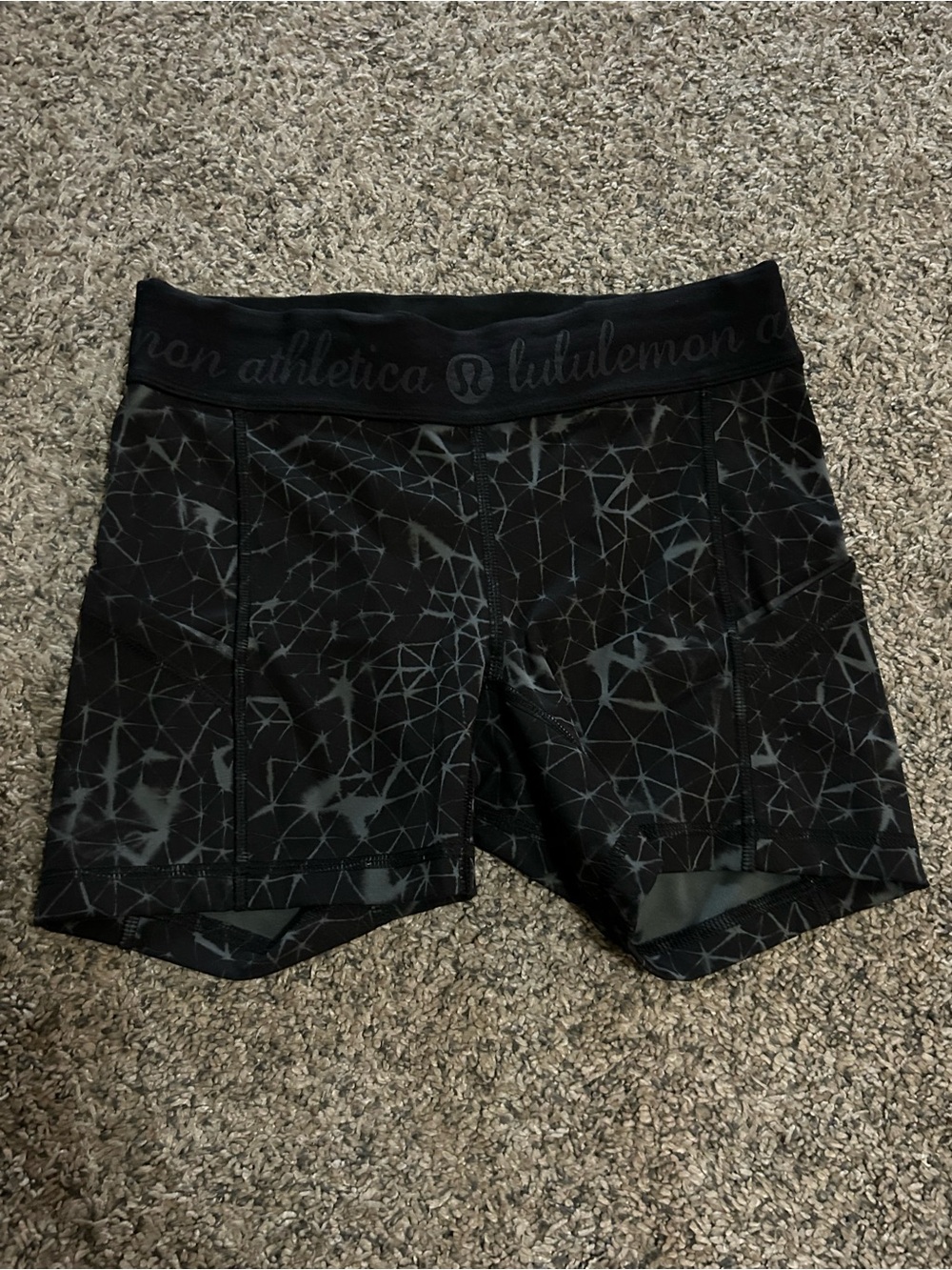 Lululemon What The Sport shorts in a black and grey geometric pattern 4”